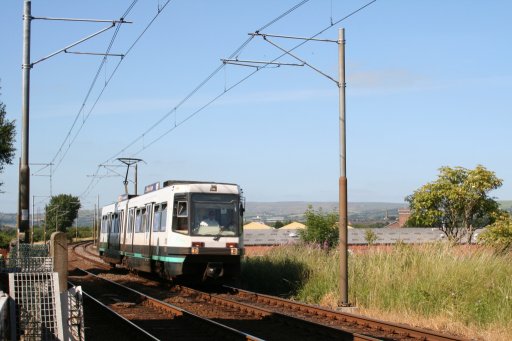 Metrolink tram 1018 at Hagside Crossing