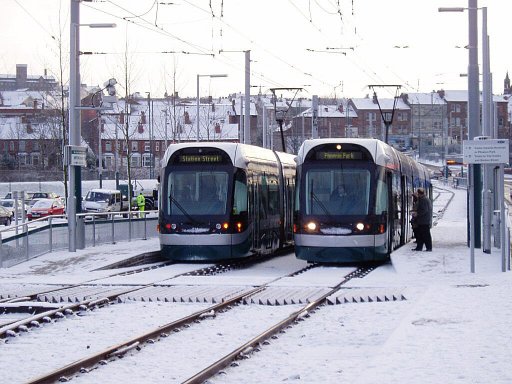 Nottingham Express Transit tram snow at Wilkinson Street stop