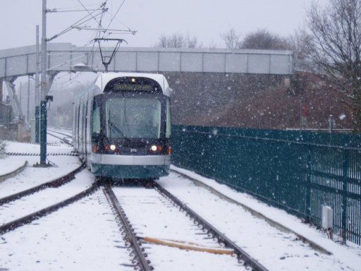 Nottingham Express Transit tram snow at Butler's Hill