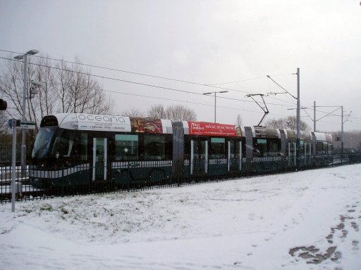 Nottingham Express Transit tram snow at Butler's Hill stop