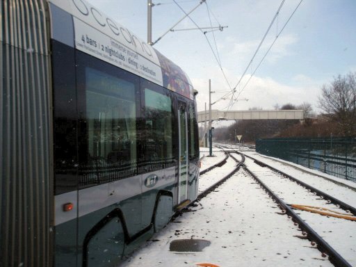 Nottingham Express Transit tram snow at Butler's Hill